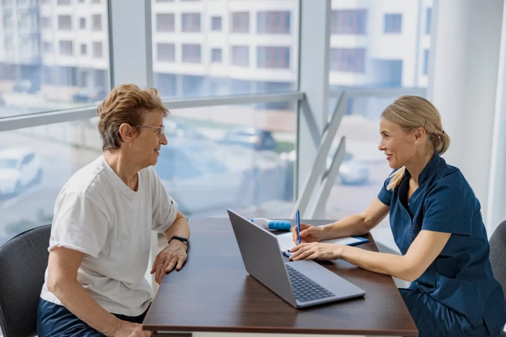 smiling doctor fills out the medical report form o 2022 06 24 14 22 51 utc