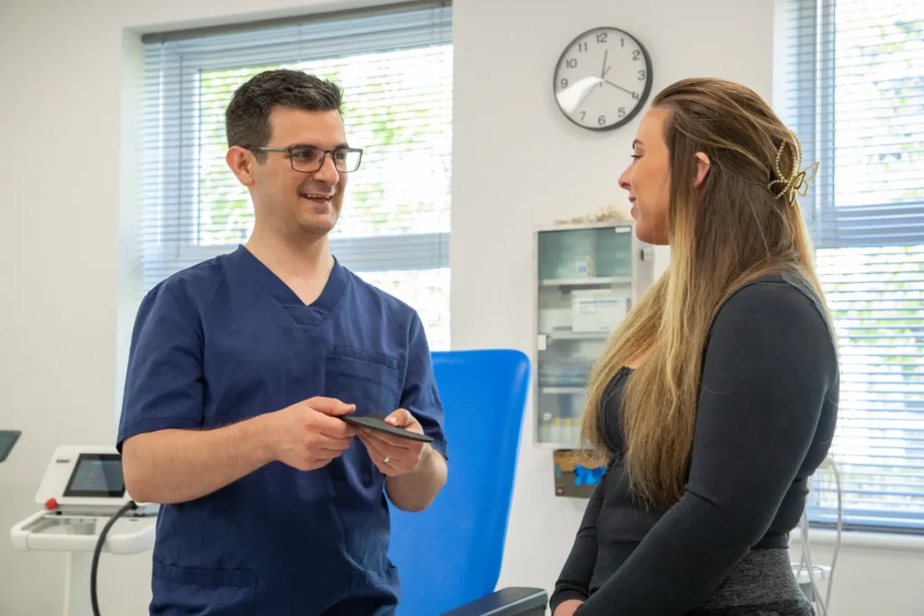 Home 3 Luke mccarthy bedford podiatrist with patient demonstrating orth 5ccceb419f91ee4e2344c2afaa1c61ec